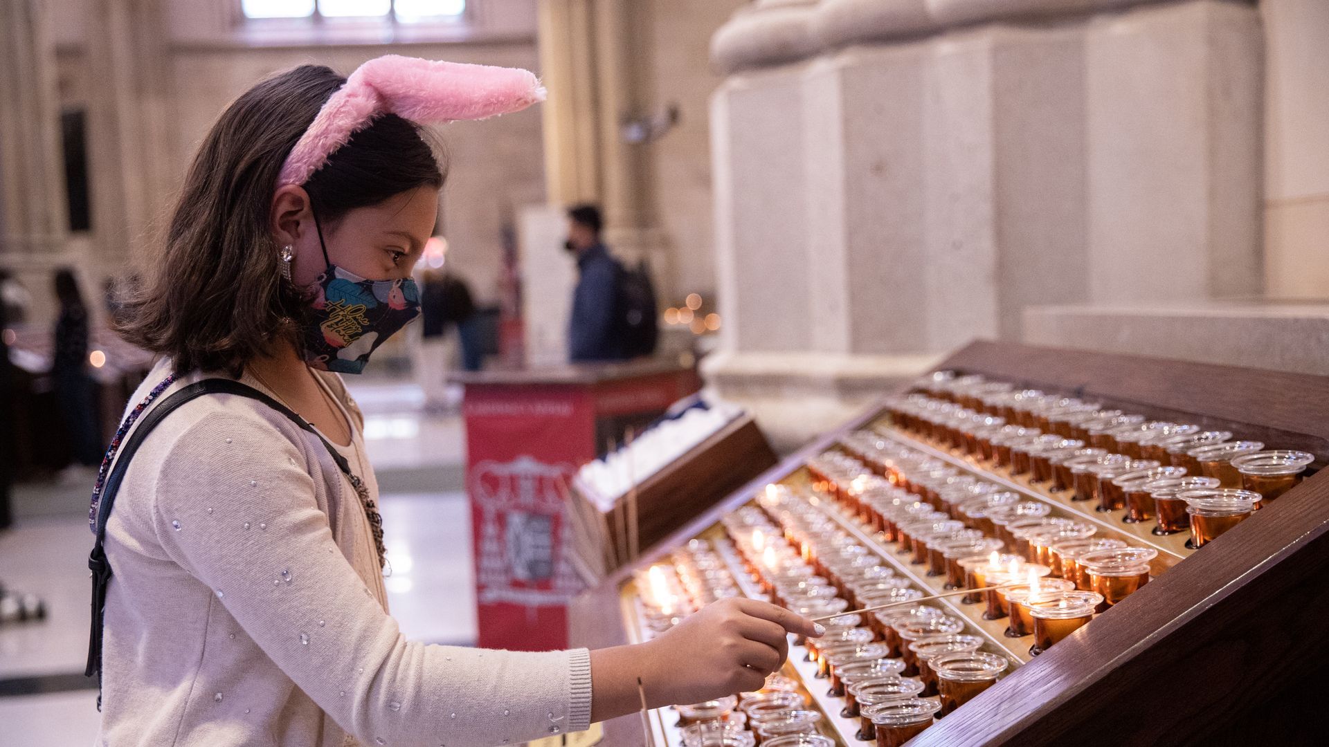 A girl wears a bunny hairband at Saint Patrick's Cathedral on April 4, 2021 in New York City.