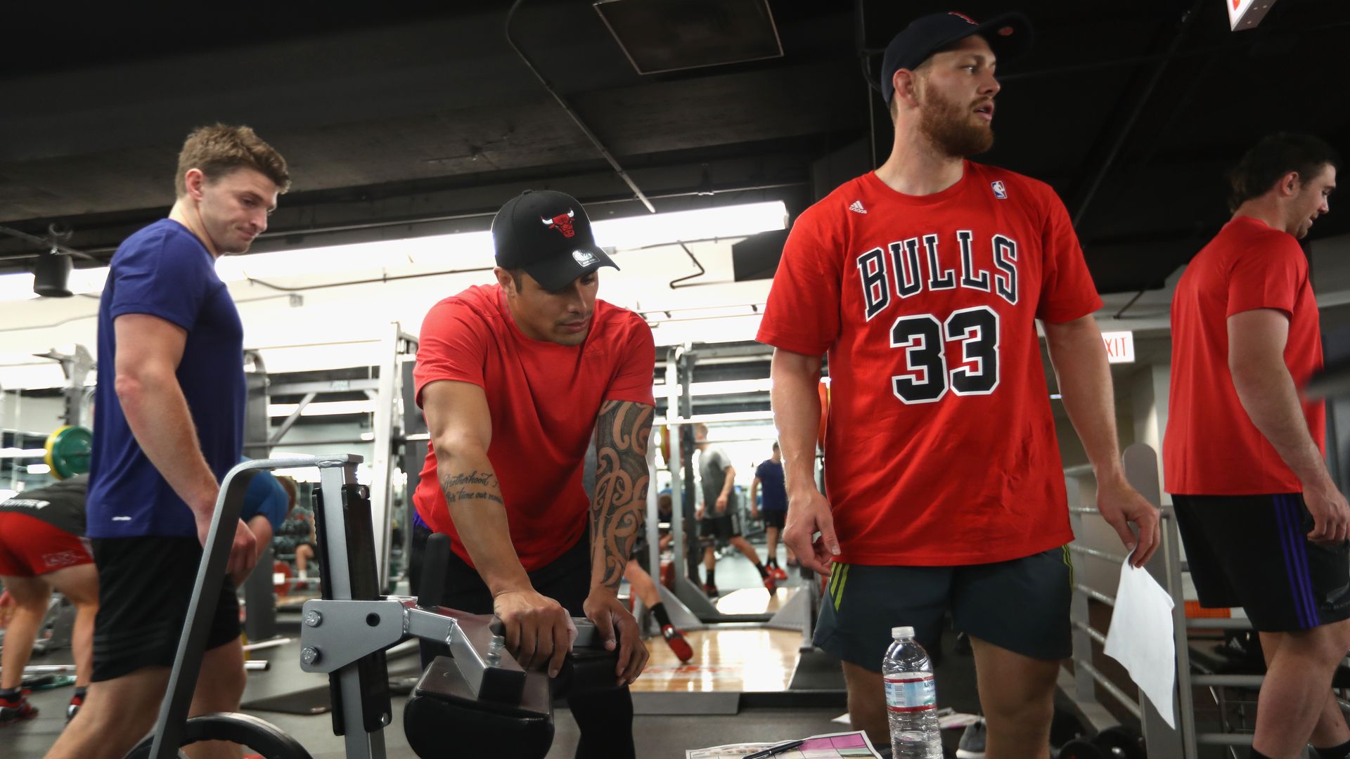 eauden Barrett, Aaron Smith and Tawerau Kerr-Barlow of the New Zealand All Blacks train during a gym session
