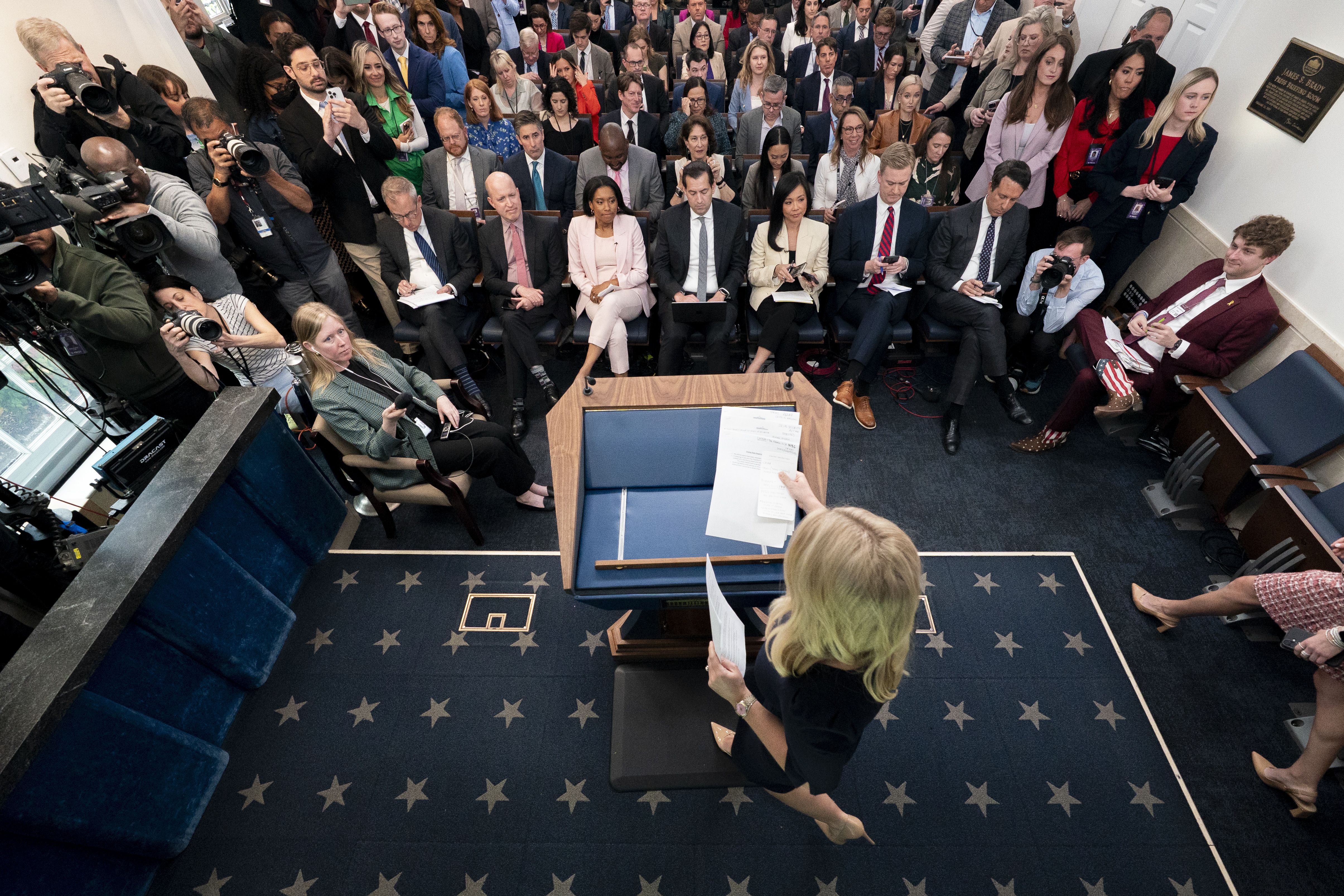 Matthew Foldi of the Trump-friendly Washington Reporter (at right, in star-spangled boots) in the White House briefing room on Tuesday.