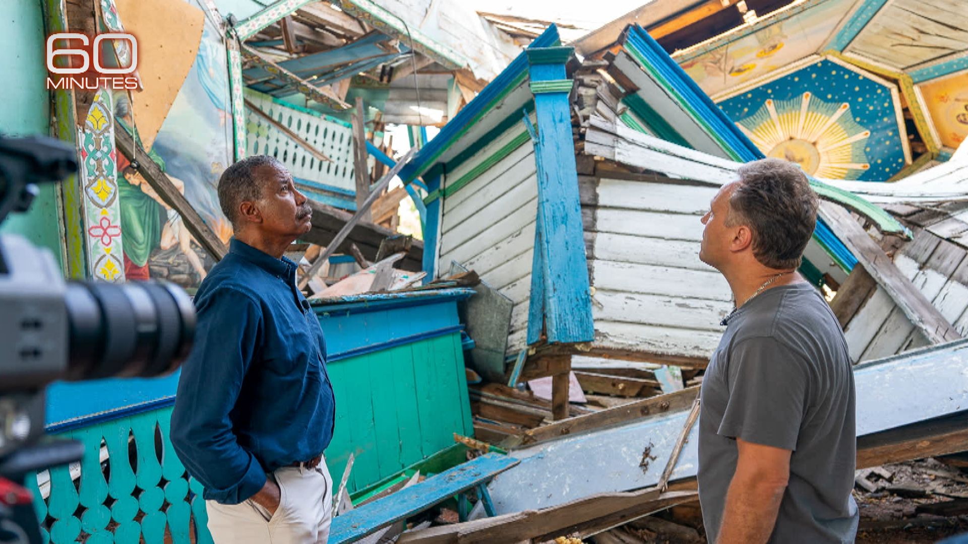 CBS' Bill Whitaker with Ukrainian museum official Ihor Poshyvailo during their "60 Minutes" interview in a church destroyed by Russian forces.