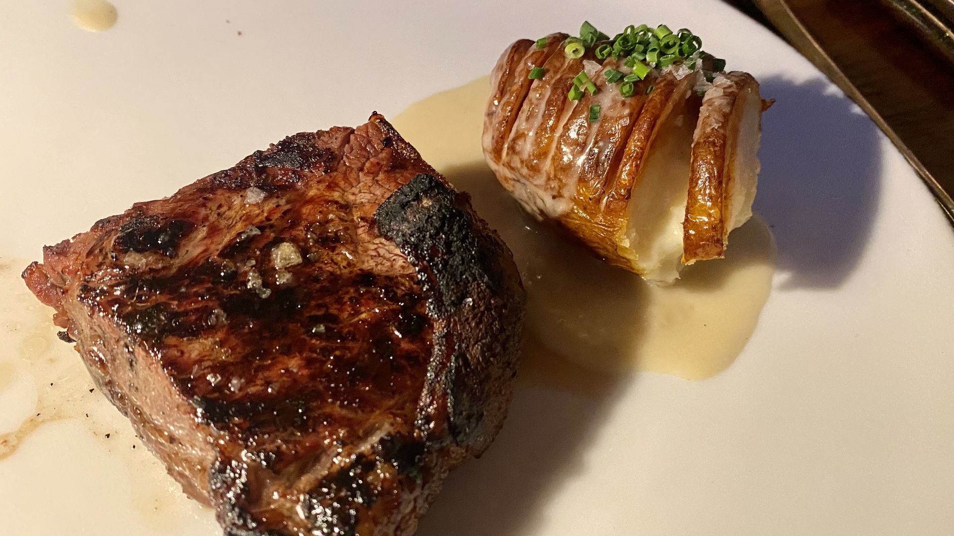 Prime New York strip with a hasselback potato.