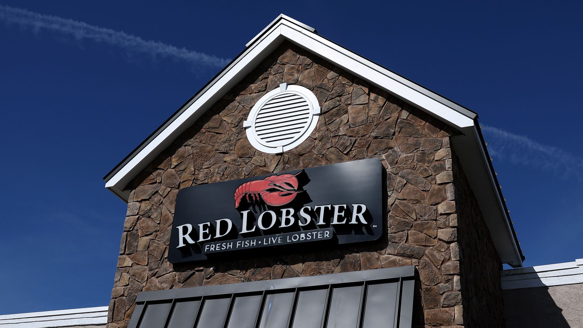 The exterior of a restaurant with a sign reading "Red Lobster."