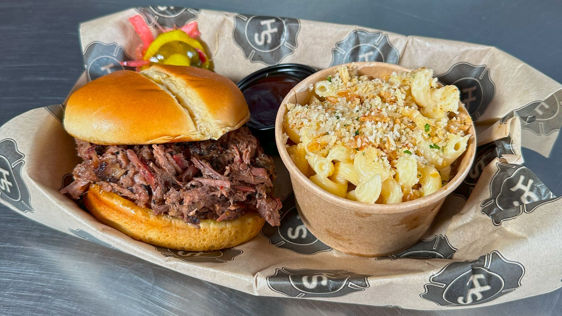 Station House BBQ's chopped brisket sandwich with a side of mac and cheese. 