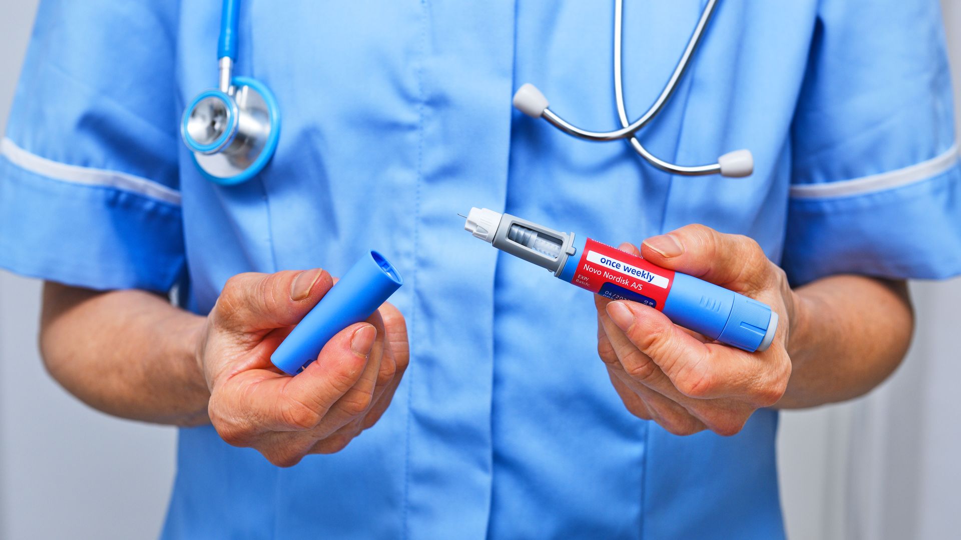 Doctor holds Ozempic injection pen