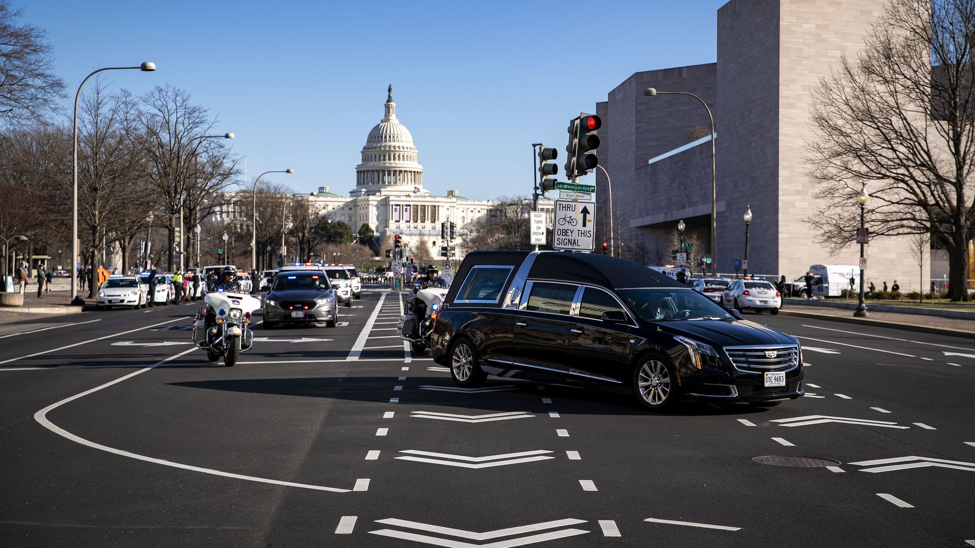 A hearse is seen passing the Capitol as it carries the body of a police officer who died after last week's seige.