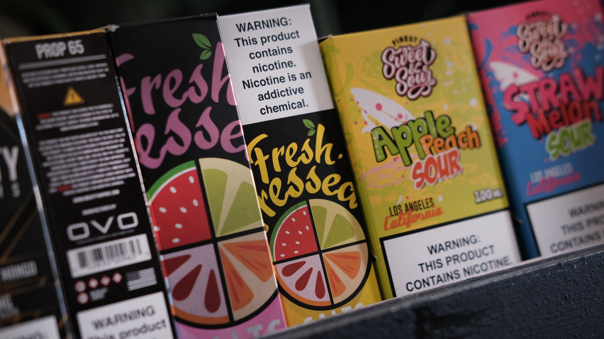 Flavored vaping products on a shelf