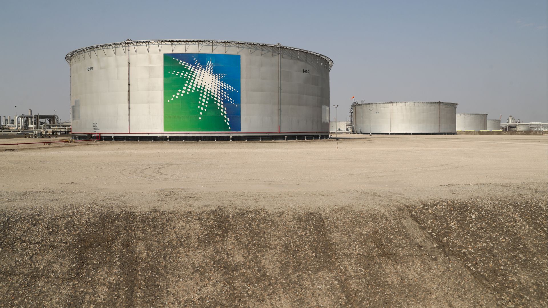 Oil tanks at an oil processing facility of Saudi Aramco, a Saudi Arabian state-owned oil and gas company, at the Abqaiq oil field.
