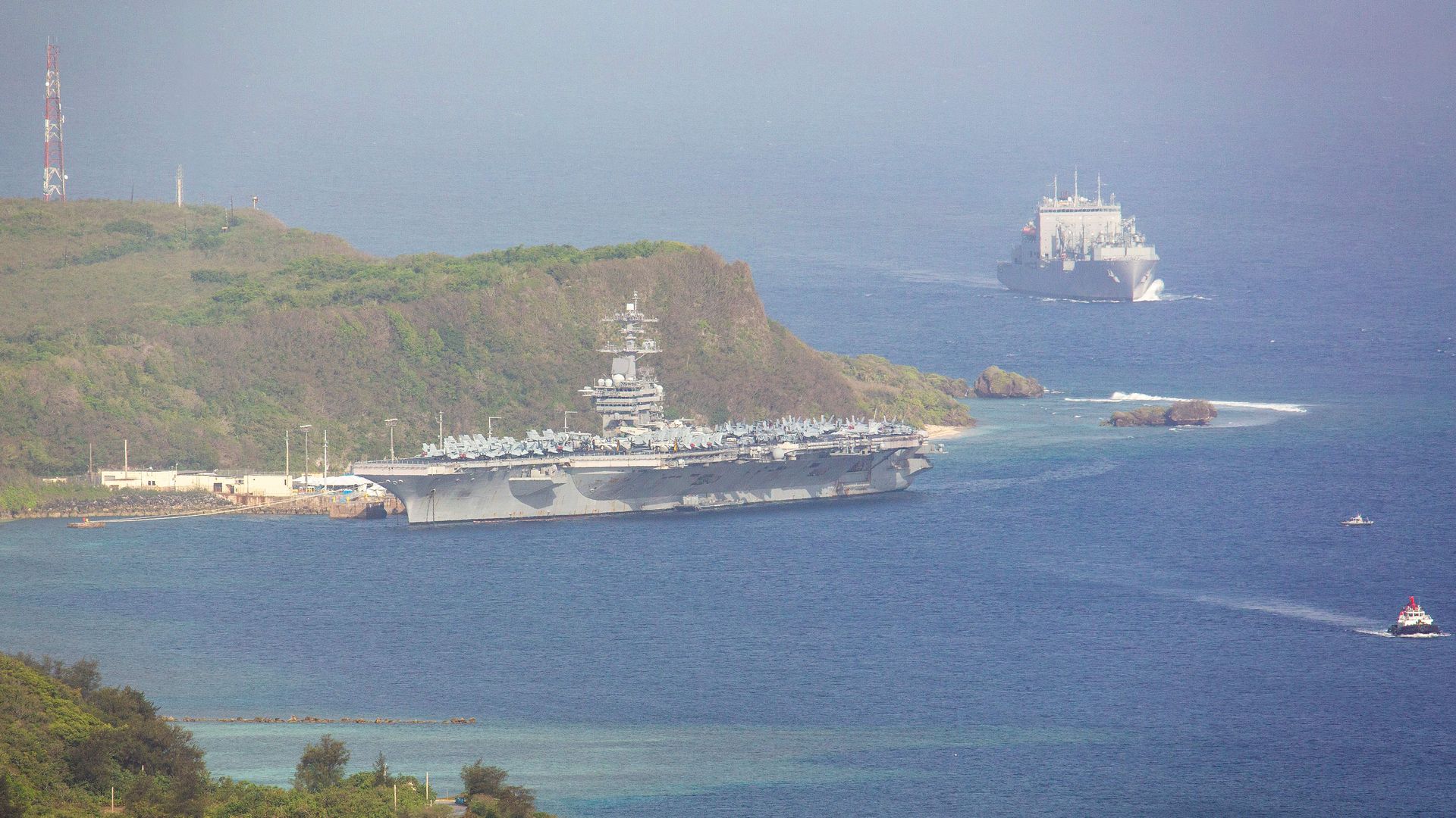 The aircraft carrier USS Theodore Roosevelt, is docked at Naval Base Guam in Apra Harbor