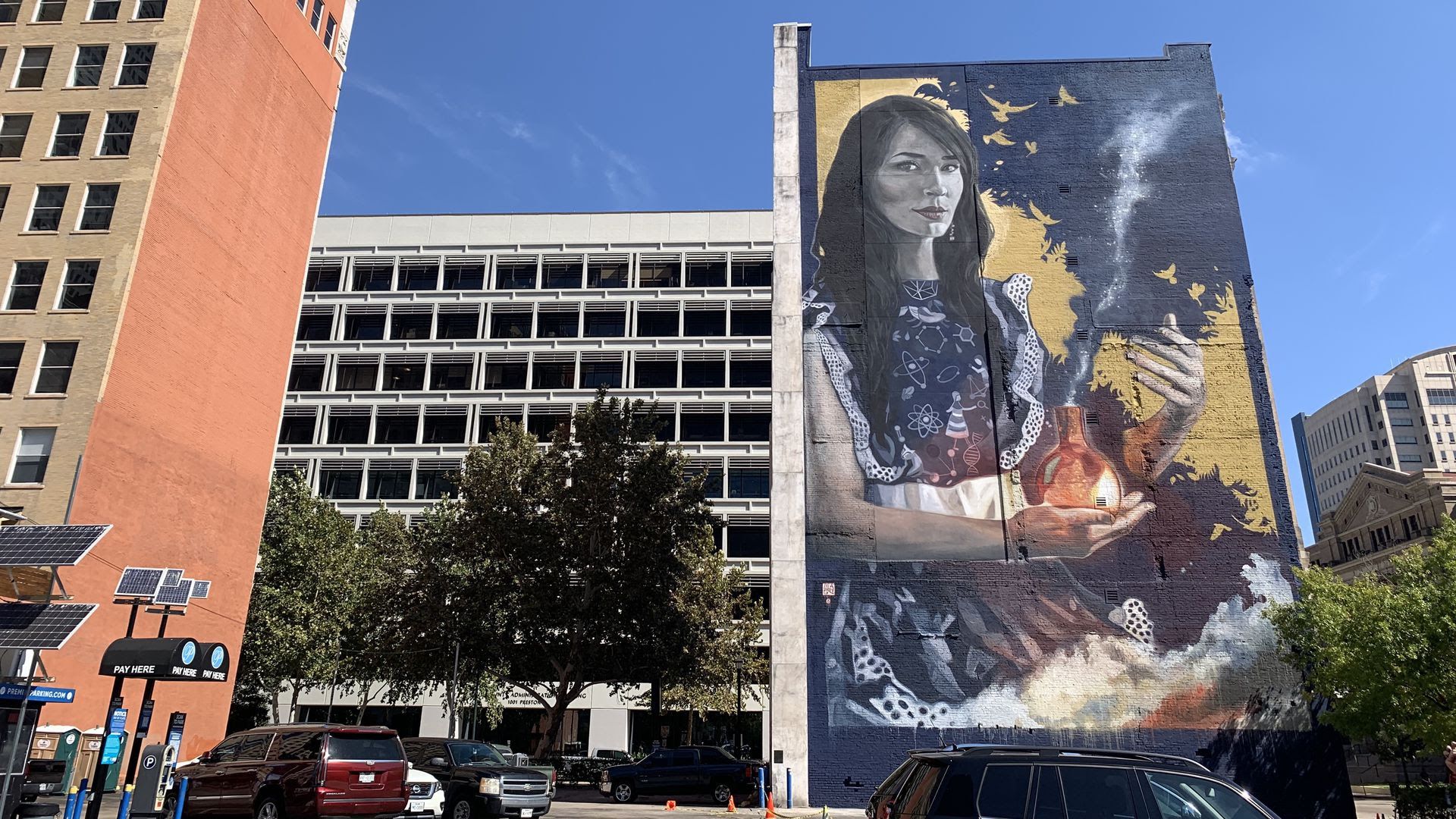 Photo of a mural of a Latina scientist. 