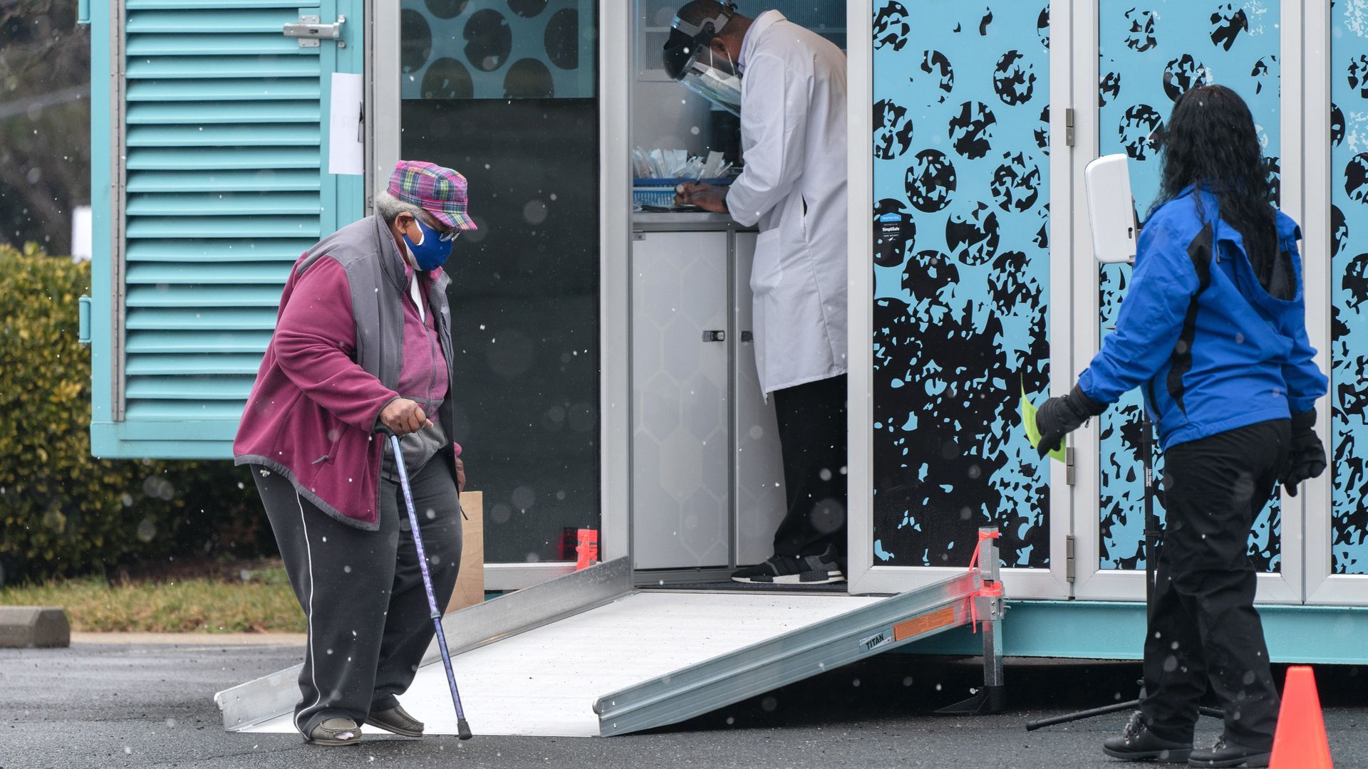 A woman arrives at a COVID-19 vaccination clinic outside the Pennsylvania Avenue Baptist Church in southeast D.C.