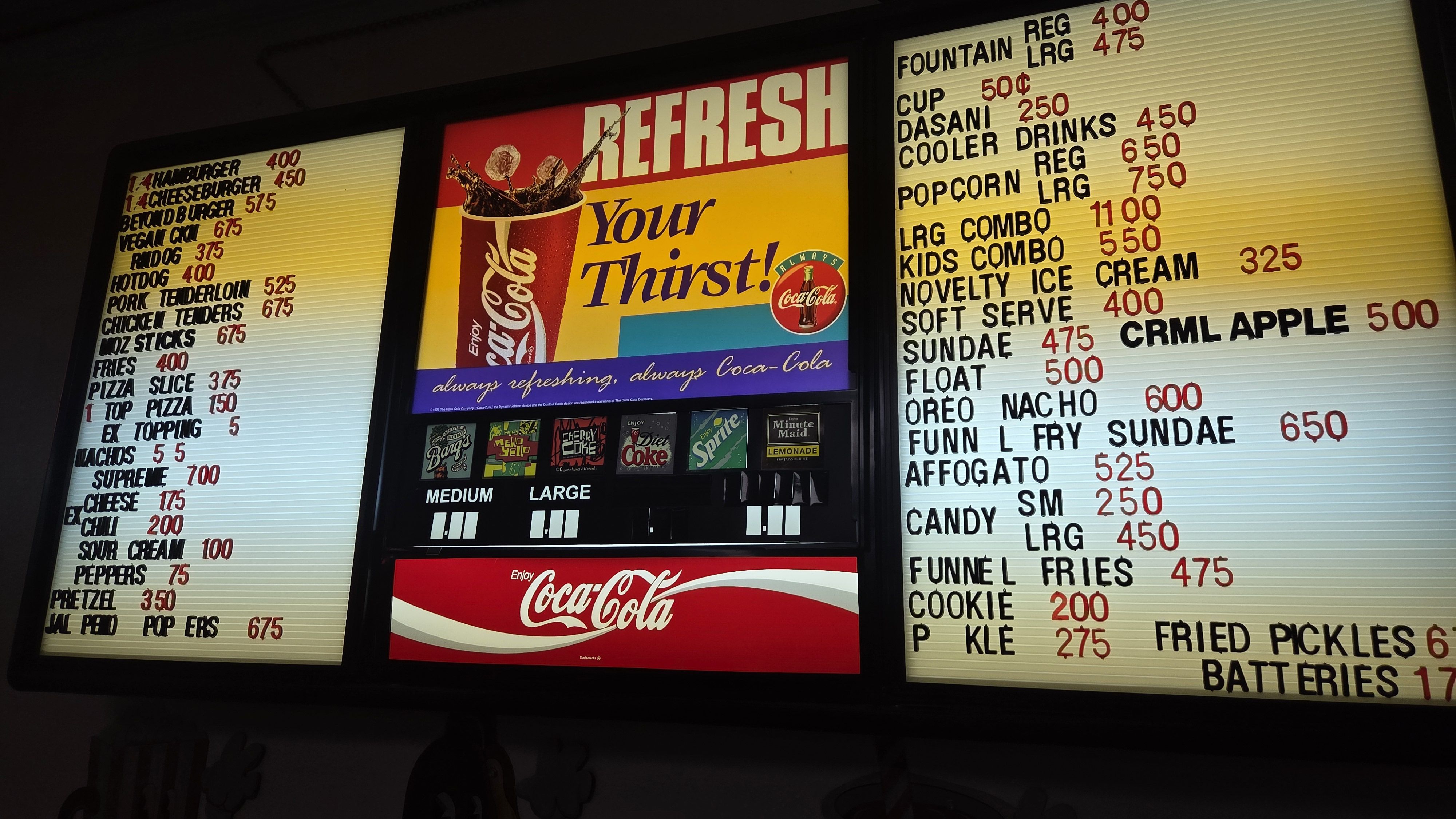 Three-panel diner menu board: left shows burgers and fries; center features a Coca-Cola ad with the slogan "REFRESH Your Thirst!"; right lists items and prices in red and black.