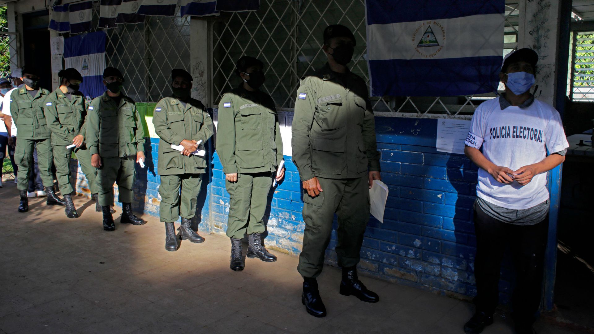 Members of Nicaragua's army wait in line to vote during general election, at a polling station in Managua on November 7, 2021.