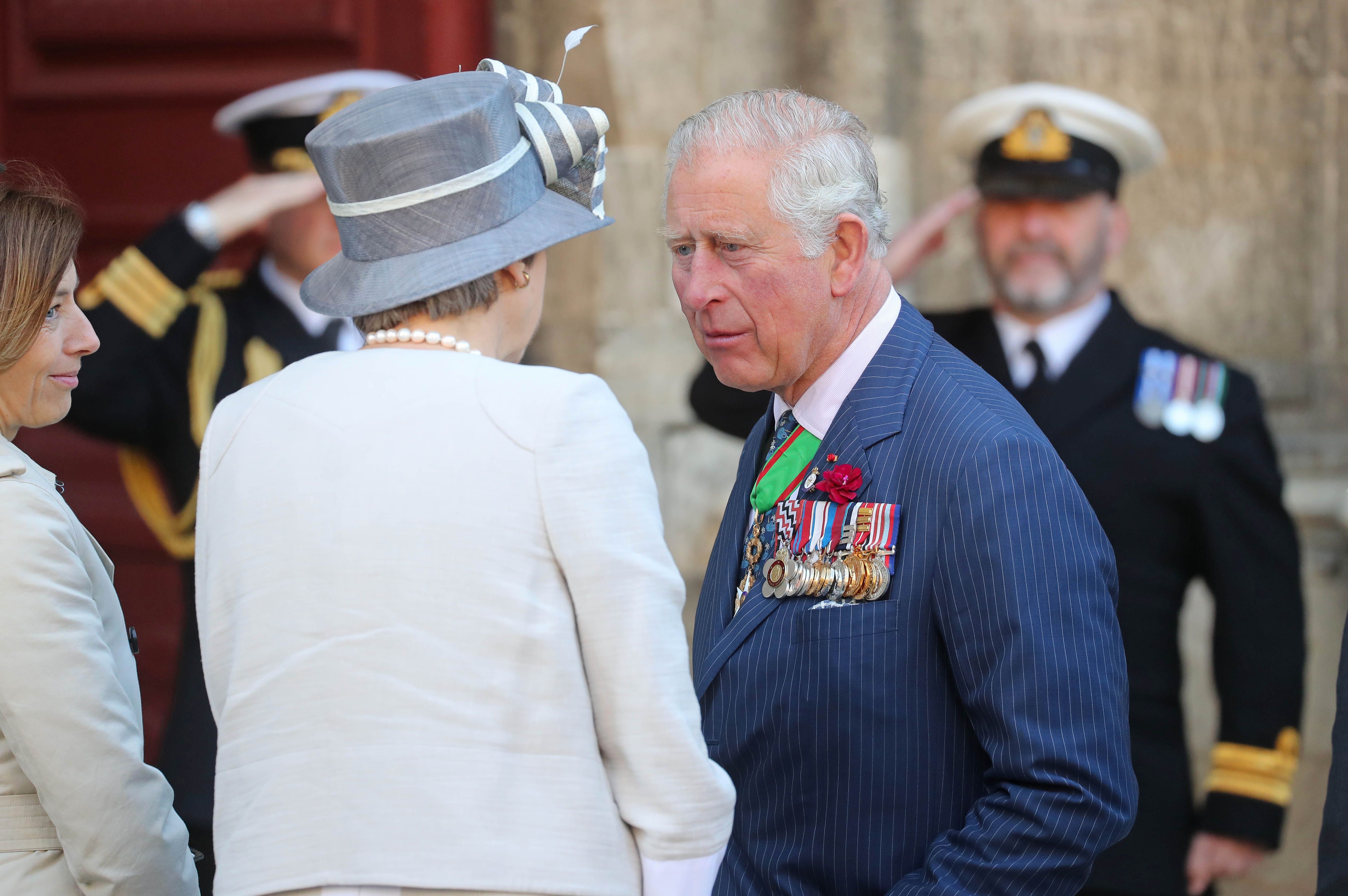 Britain's Prime Minister, Theresa May greets Prince Charles, Prince of Wales outside Bayeux Cathedral on June 06, 2019 in Bayeux, France.