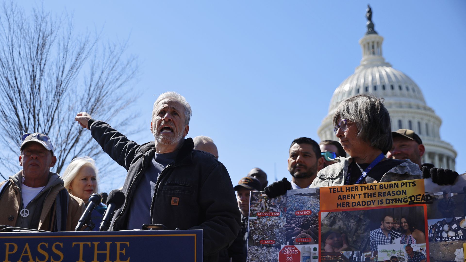 Jon Stewart (C) during a news conference about military burn pits legislation with veterans advocacy groups and Democratic members of Congress outside the U.S. Capitol on March 29.