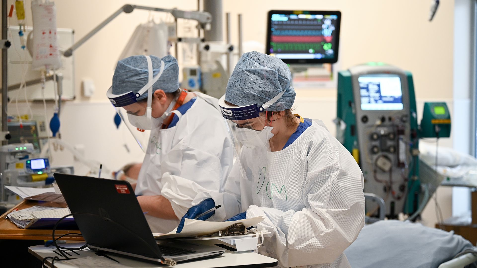  Staff at University Hospital Monklands check a patient's medical notes of a Covid positive patient on the ICU ward on February 5, 2021 in Airdrie, Scotland. 