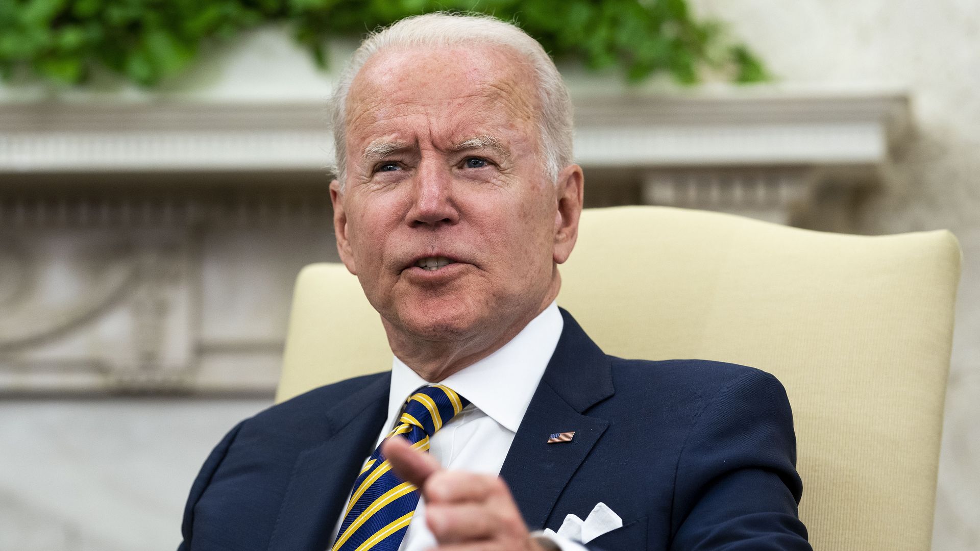 Biden speaks with an outstretched hand