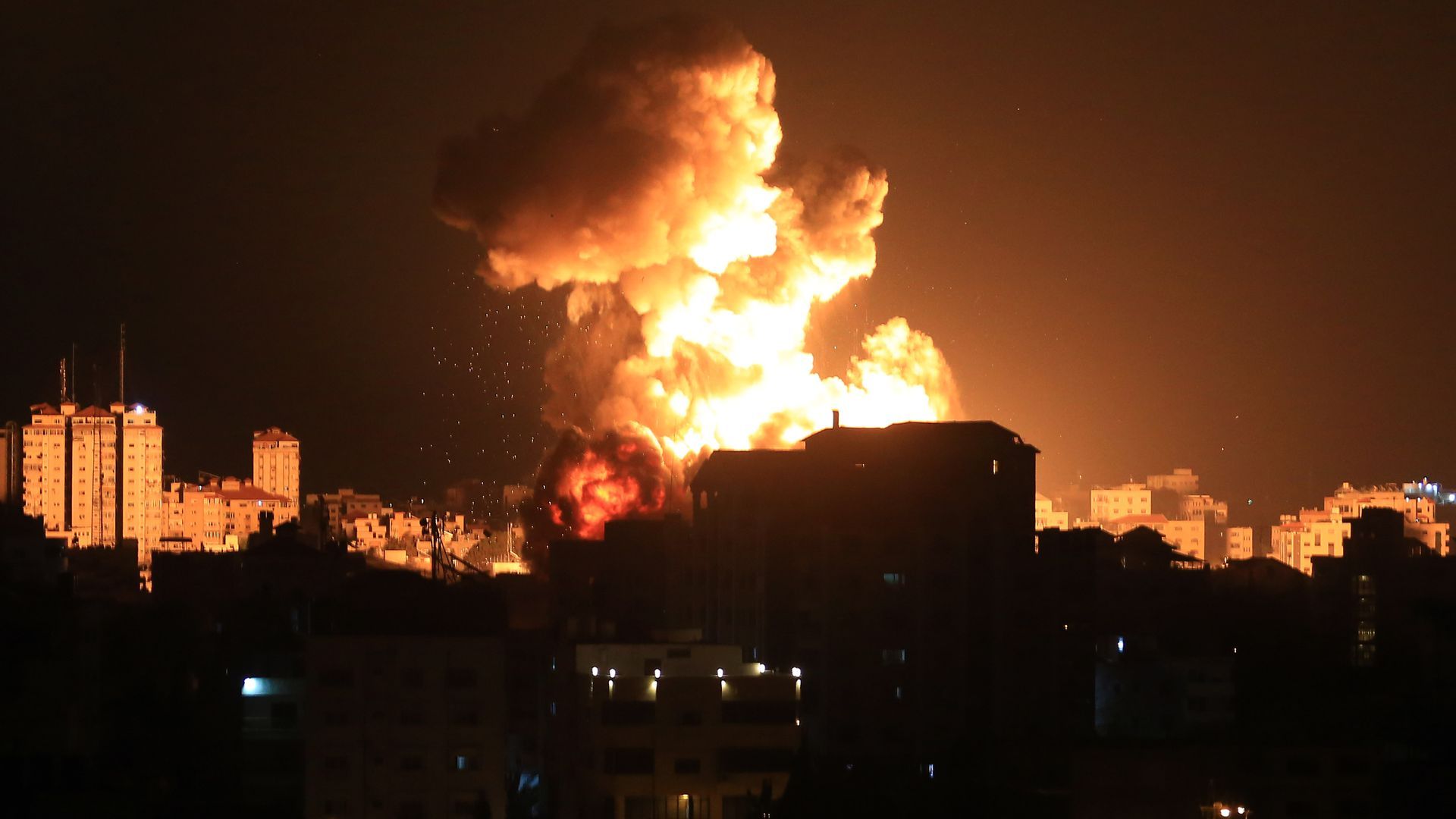 Smoke and flames rise after Israeli fighter jets conducted airstrikes in Gaza on May 13