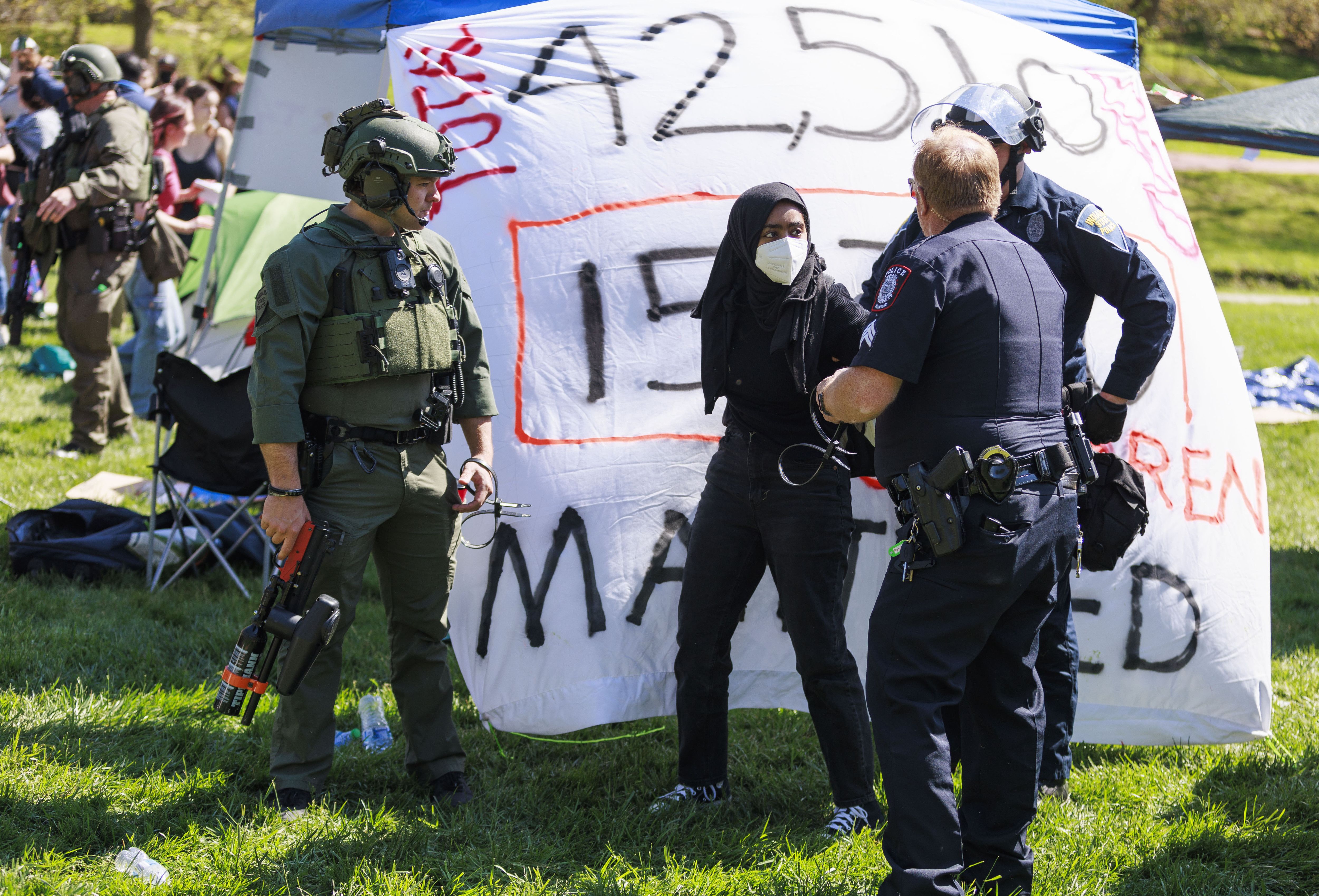 A police officer arresting protestors
