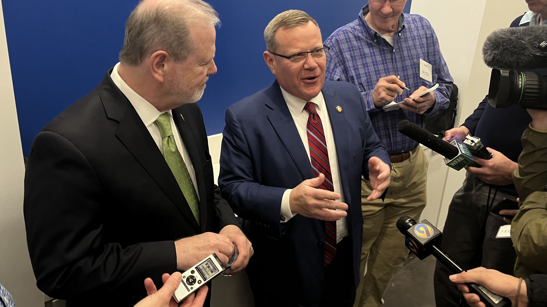 Berger and Moore talking to reporters