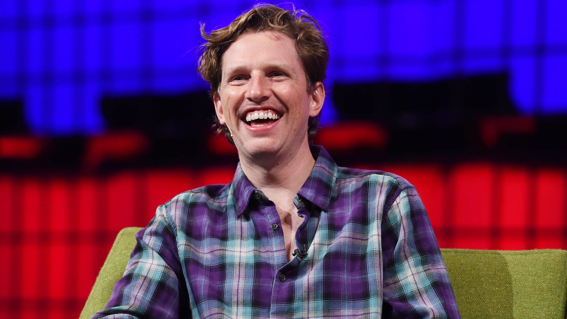 Photo of WordPress founder Matt Mullenweg smiling on stage