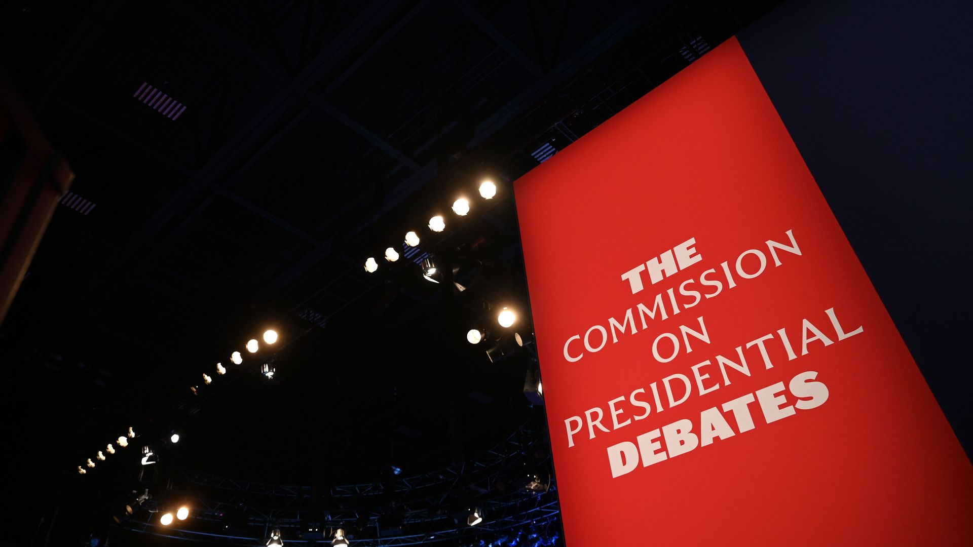The Commission on Presidential Debates banner is seen as the stage for the final presidential debate.