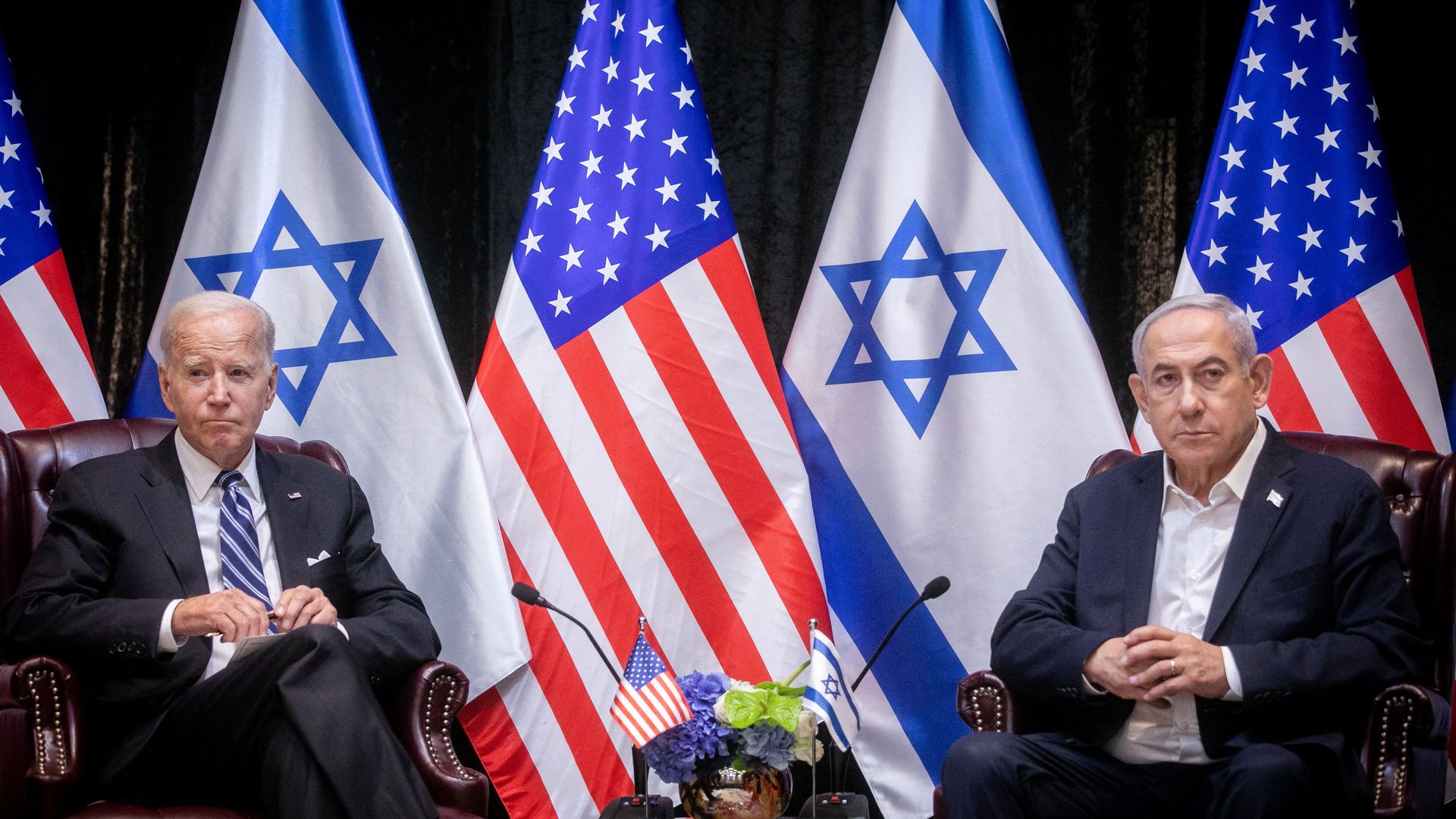 Joe Biden (L), sits with Israeli Prime Minister Benjamin Netanyahu, 