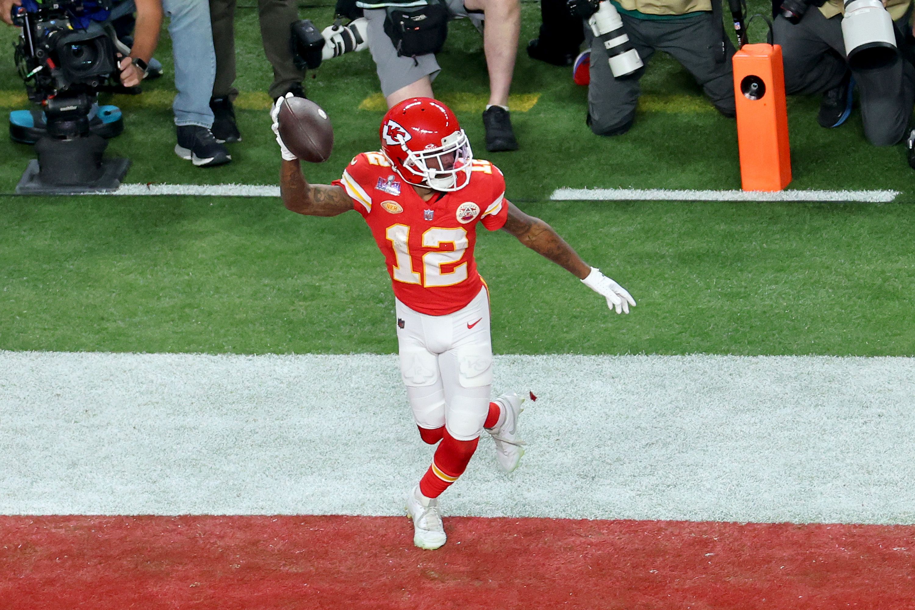 Mecole Hardman Jr. #12 of the Kansas City Chiefs celebrates after catching the game-winning touchdown in overtime to defeat the San Francisco 49ers 25-22 during Super Bowl LVIII at Allegiant Stadium on February 11, 2024 in Las Vegas, Nevada. 