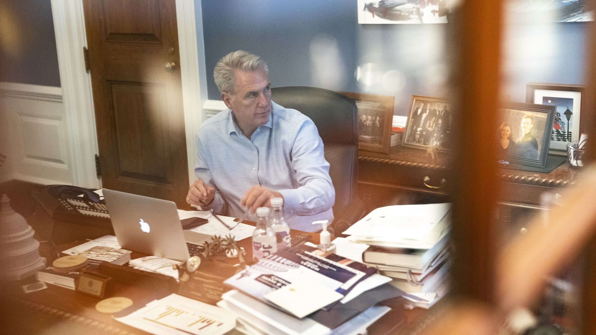 A photo of House Minority Leader Kevin McCarthy, through what appears to be a window. 