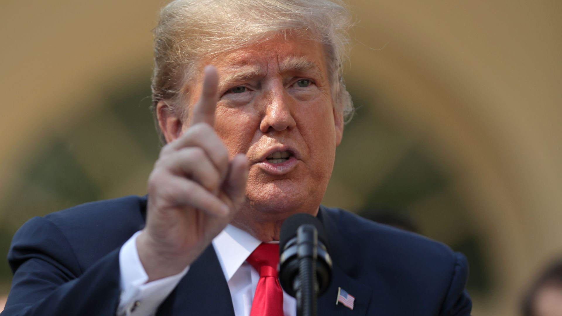 photo of Trump speaking at a press conference