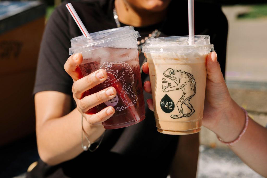 Coffee cups with the Loveland Frogman on them