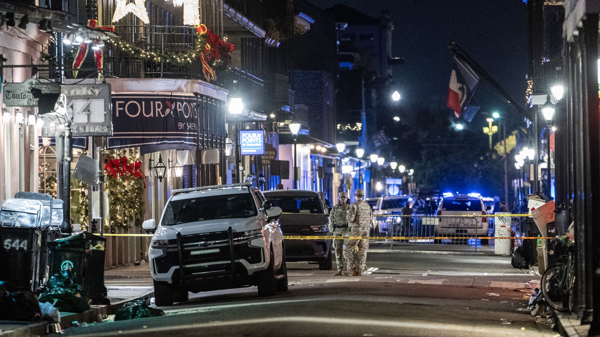 National Guardsmen patrol an empty Bourbon Street.