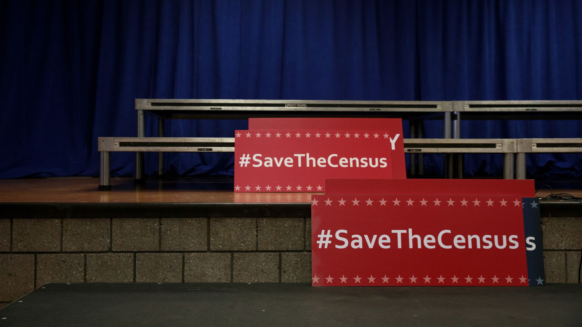 Signs that read "#SaveTheCensus" 