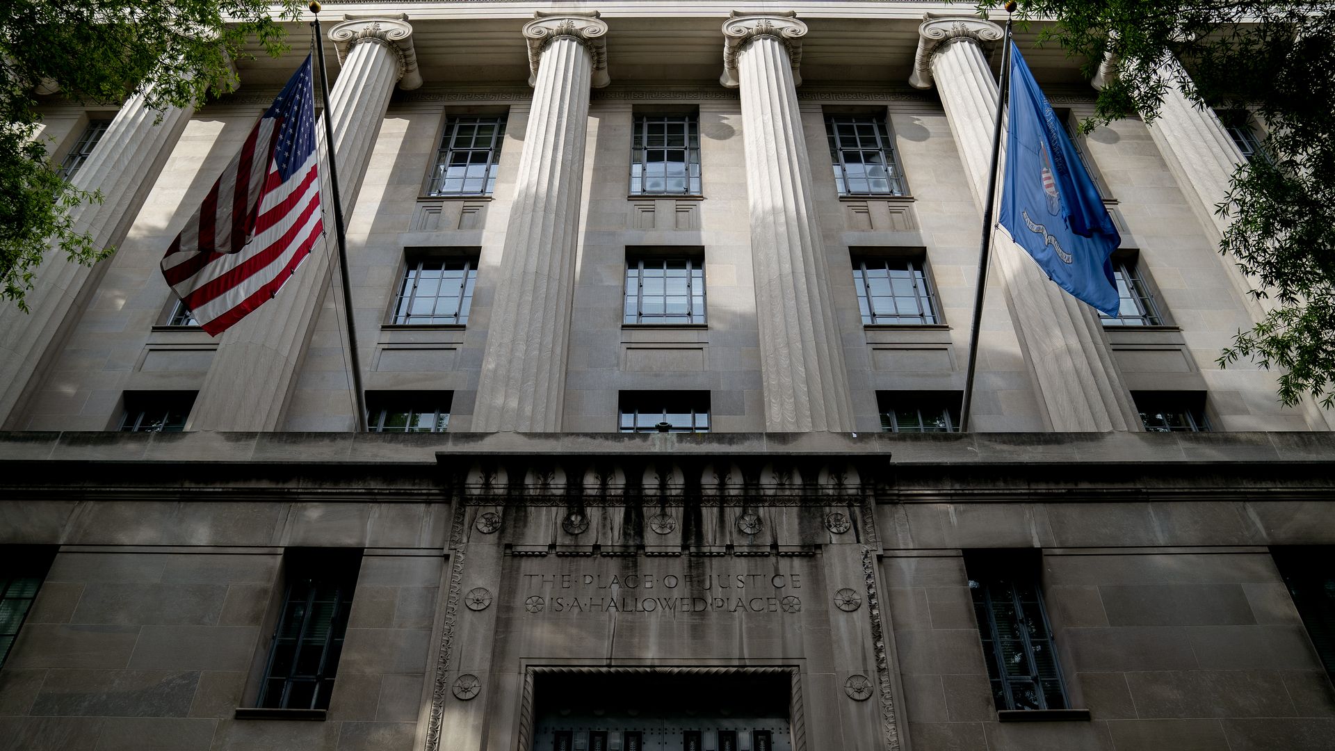An American flag flies outside the Department of Justice building in Washington, D.C. on June 21, 2021. 