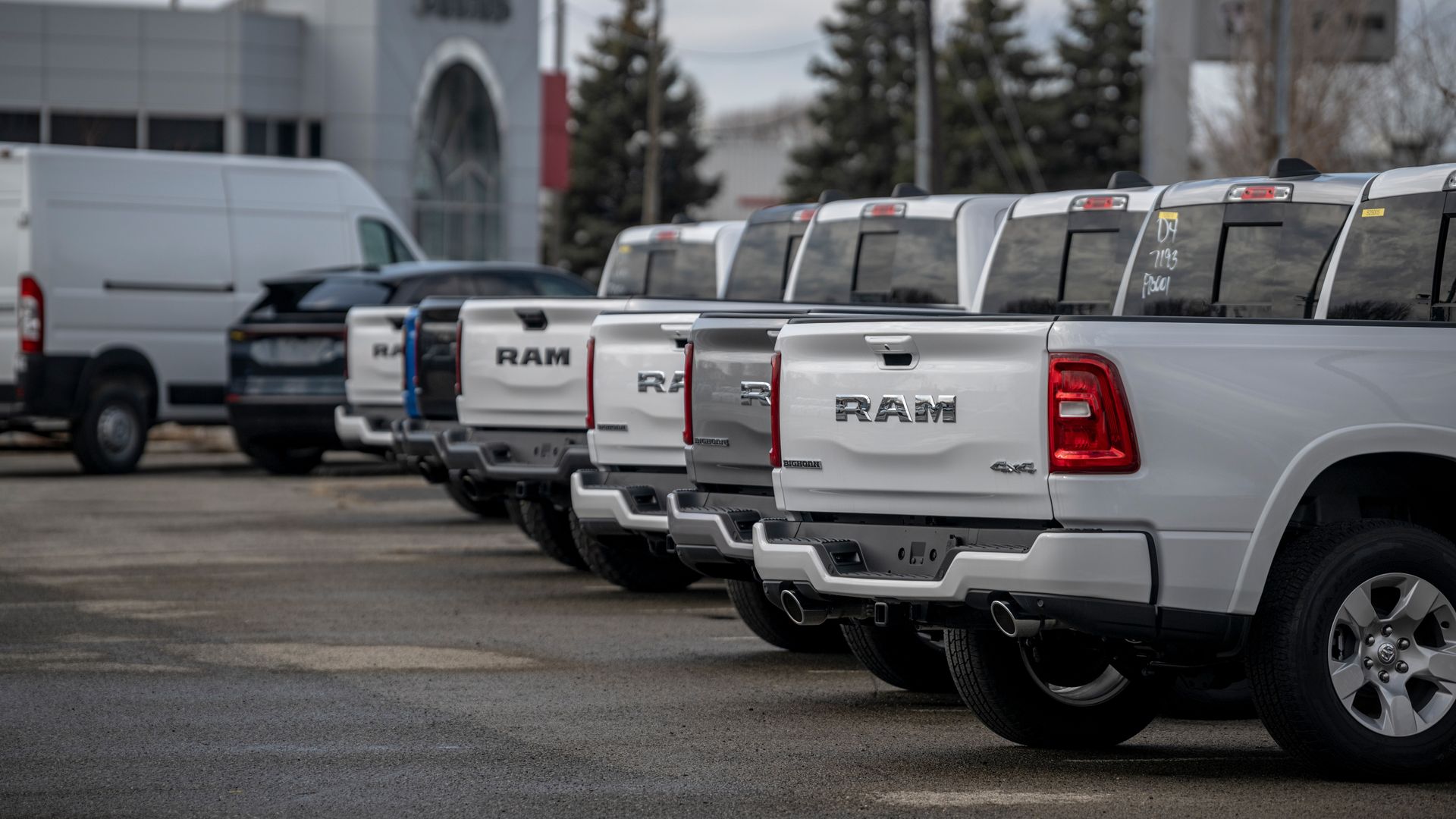 Dodge RAM pickup trucks at a dealership lot.
