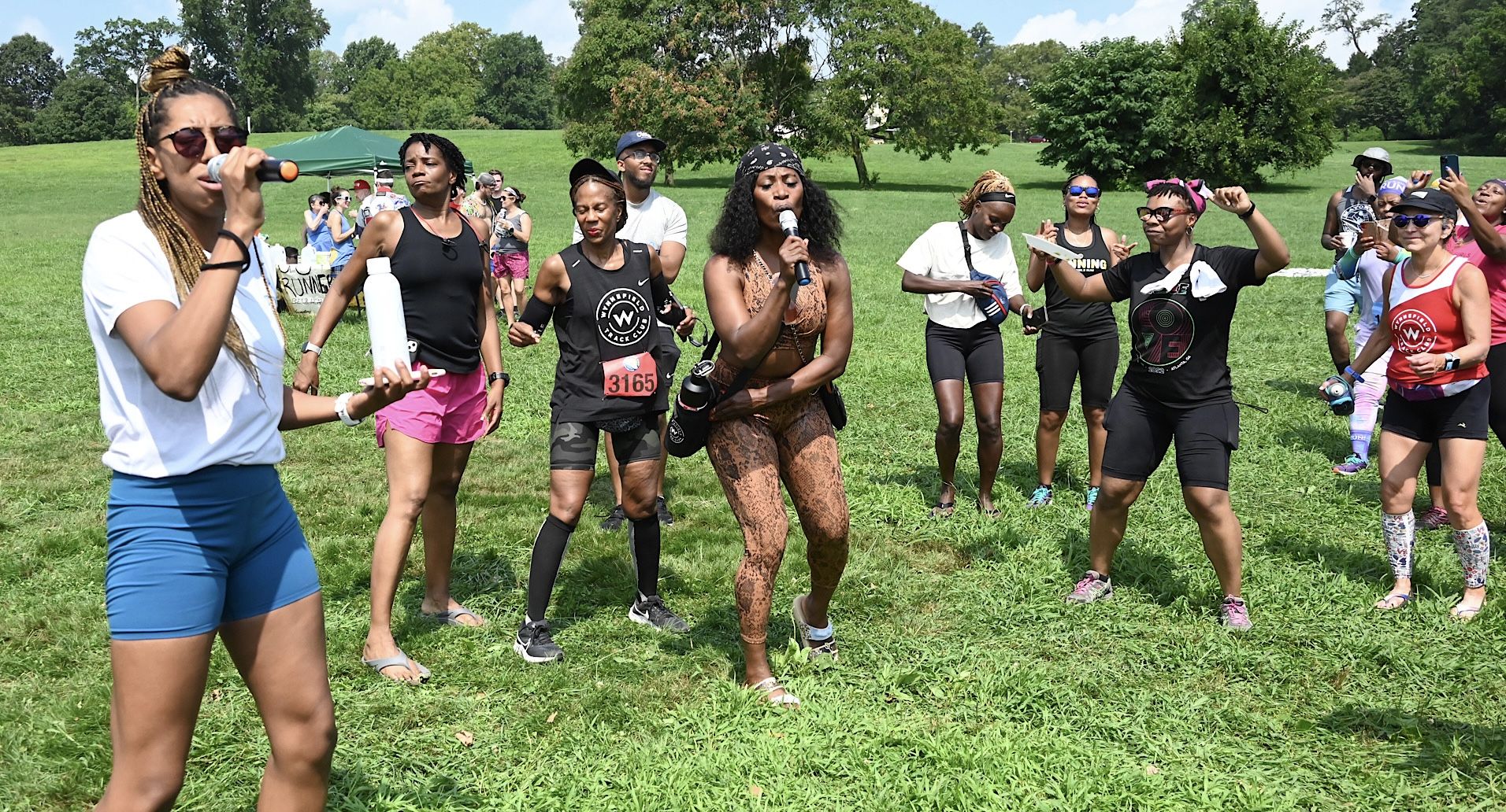 Runners participate in karaoke after the Philly Mayor’s Cup in Belmont Plateau.