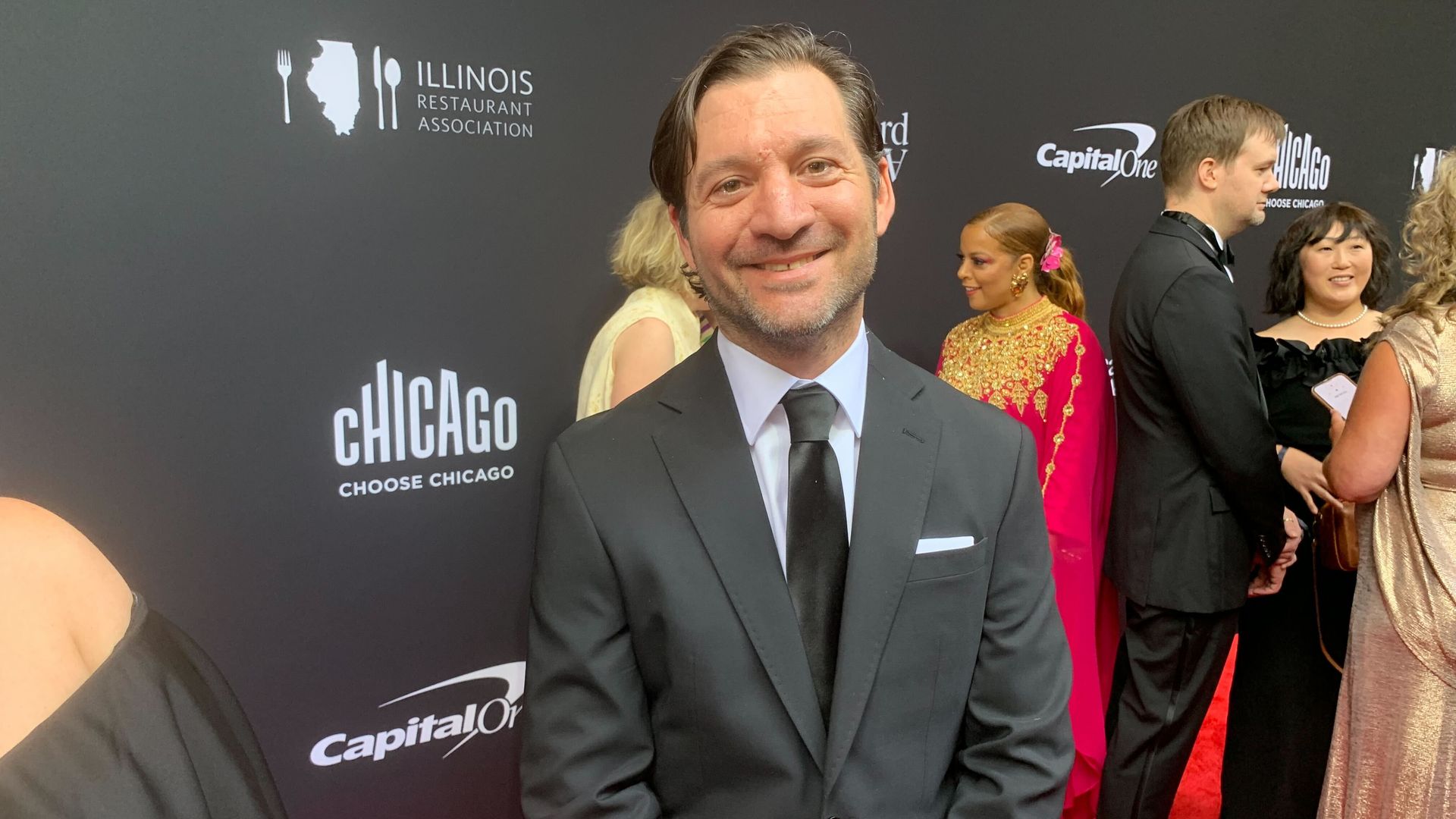 Andy Hollyday of restaurant Selden Standard poses in a suit. 