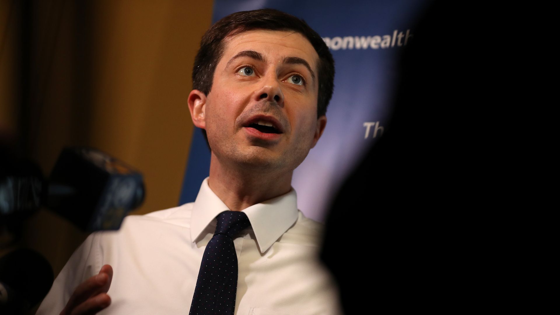 Mayor Pete Buttigieg talking, with a partial shadow in front of him. He's a potential 2020 presidential election candidate.