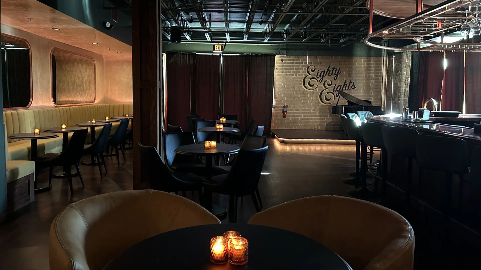 inside cocktail bar with sign that reads "Eighty Eights"