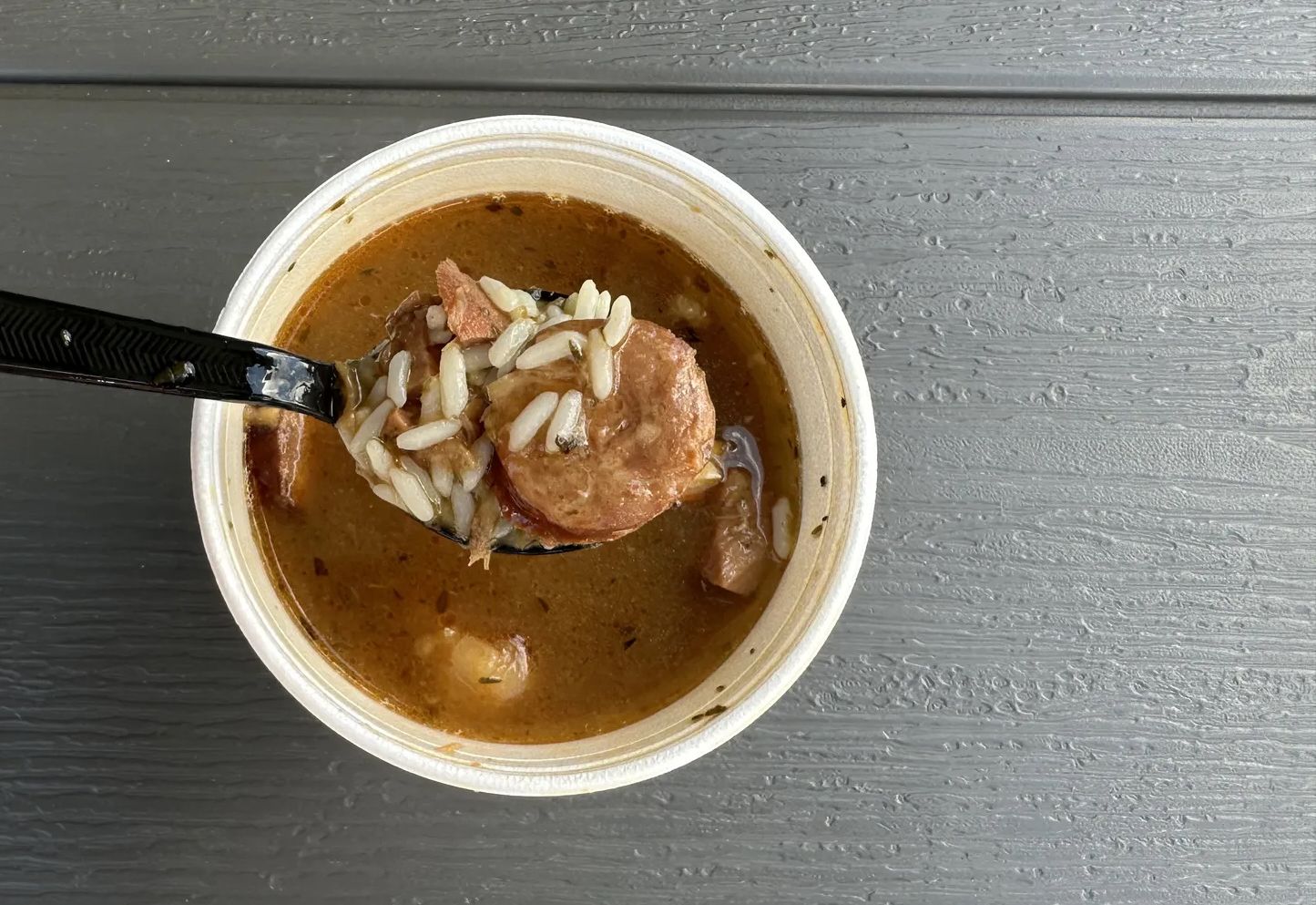 Photo shows a cup of gumbo