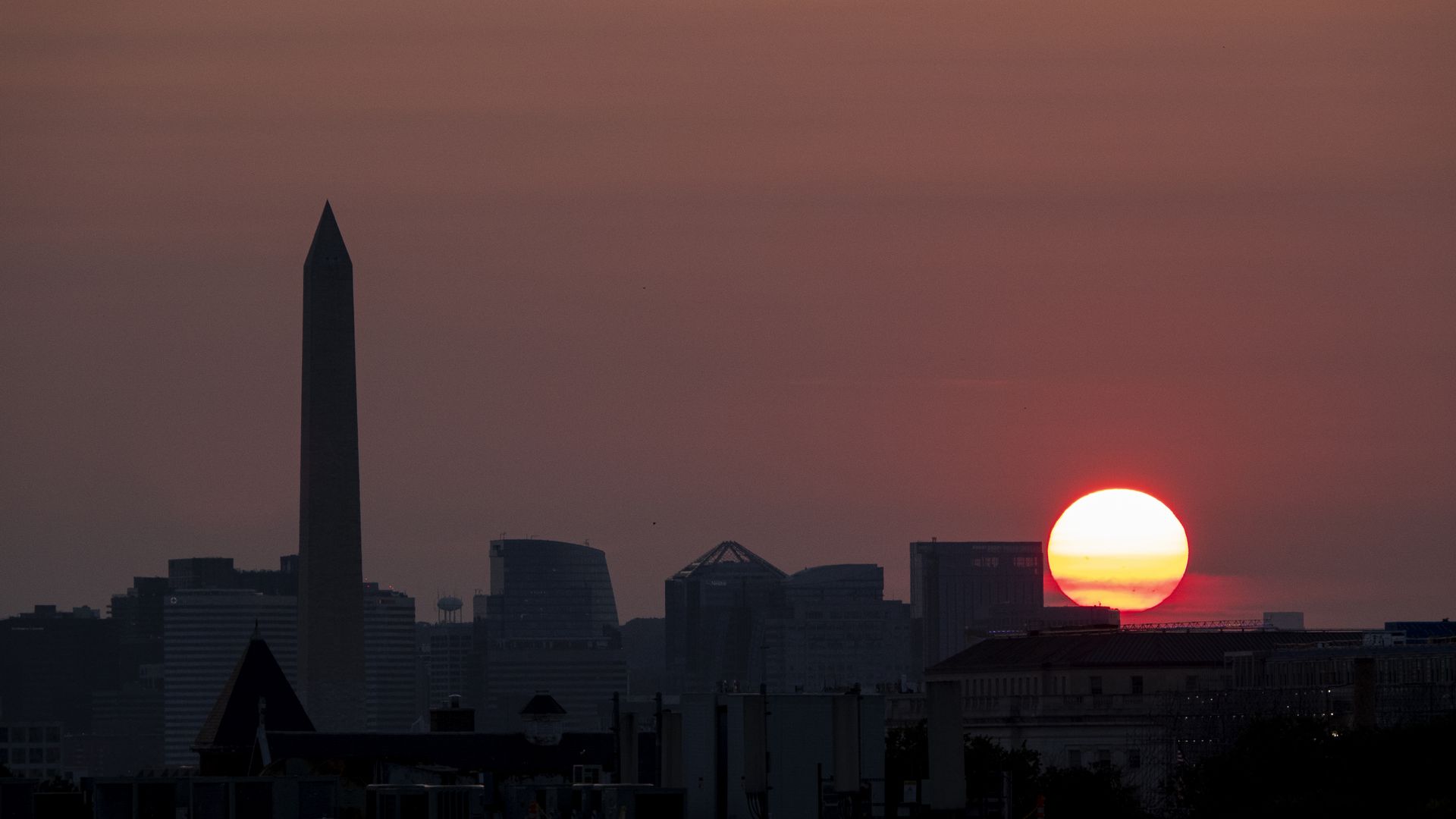 A photo of a sunset next to the Washington Monument in Washington, D.C.