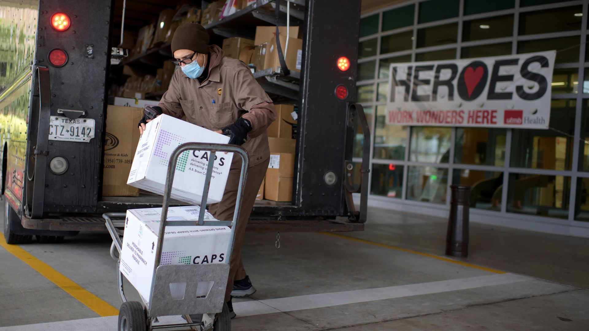 A UPS driver delivers 2,900 doses of the COVID-19 vaccine in Galveston, Texas.
