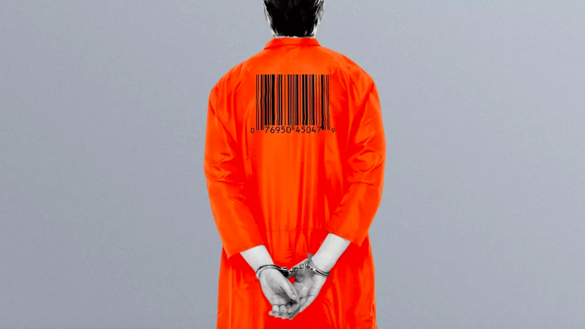 A person facing backward wearing an orange prison jumpsuit with hands cuffed behind their back and a barcode across their upper back.