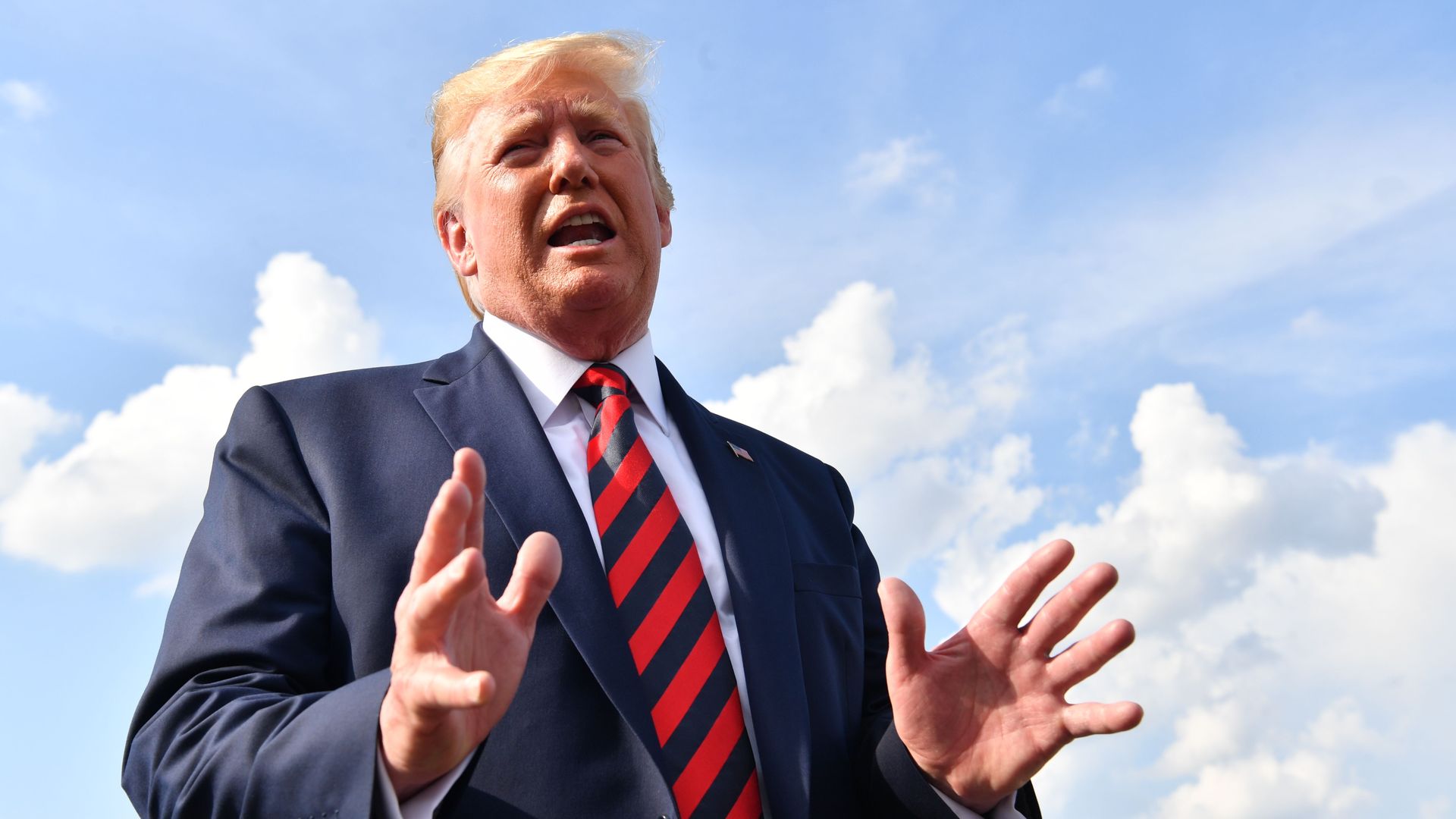 President Donald Trump speaks to the press before boarding Air Force One in Morristown, New Jersey, on August 18