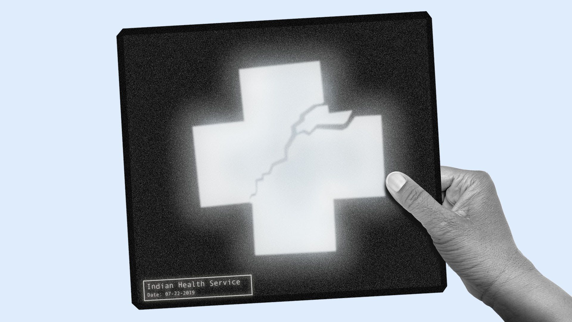 A hand holding up a broken health care symbol x-ray