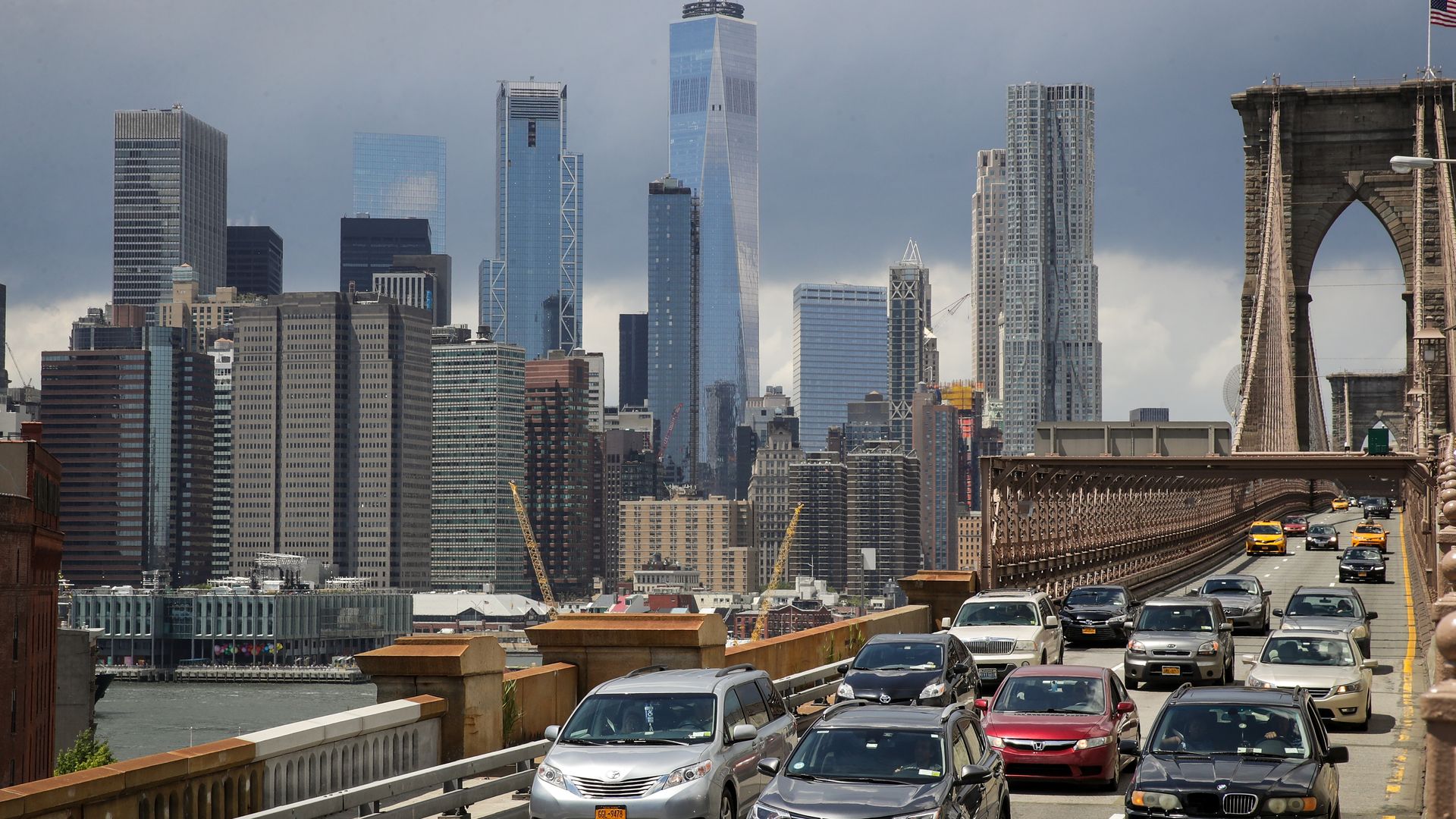 cars on the Brooklyn Bridge with view of lower Manhattan, NYC