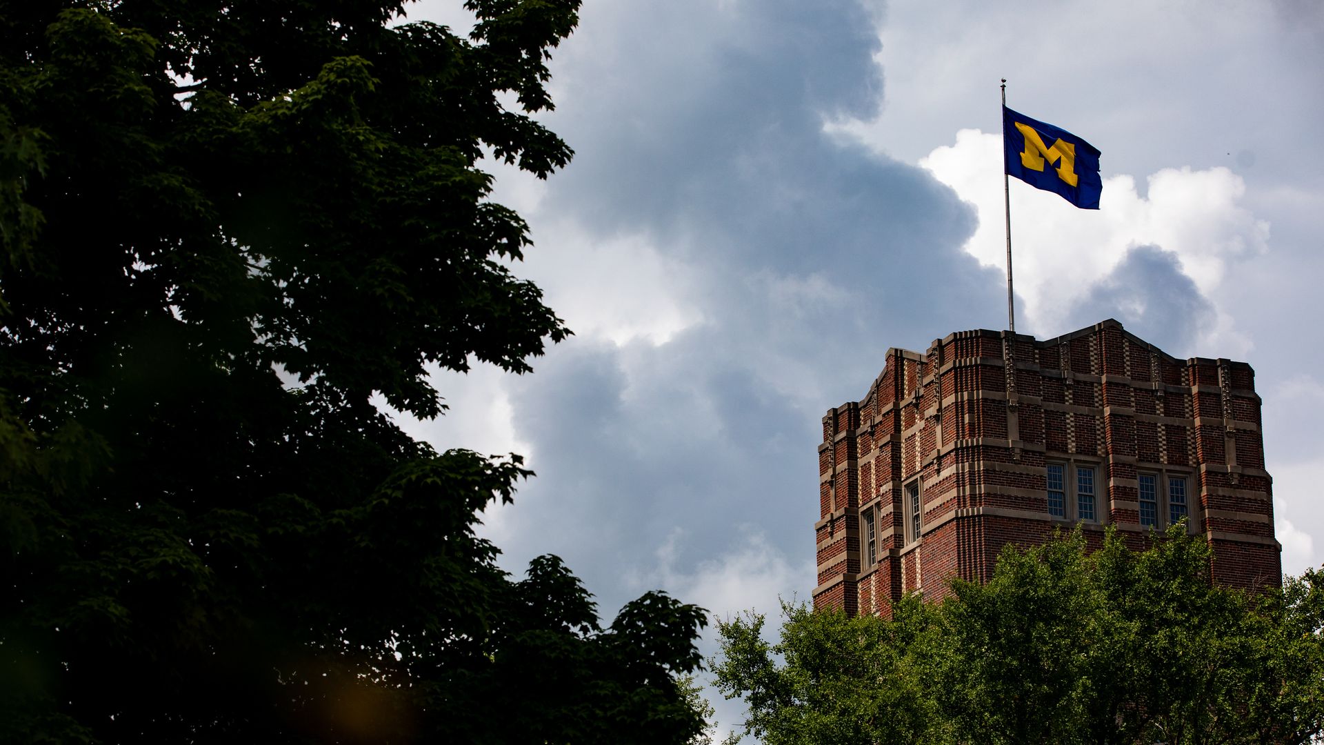 A U-M flag on the Michigan Union building in 2025.