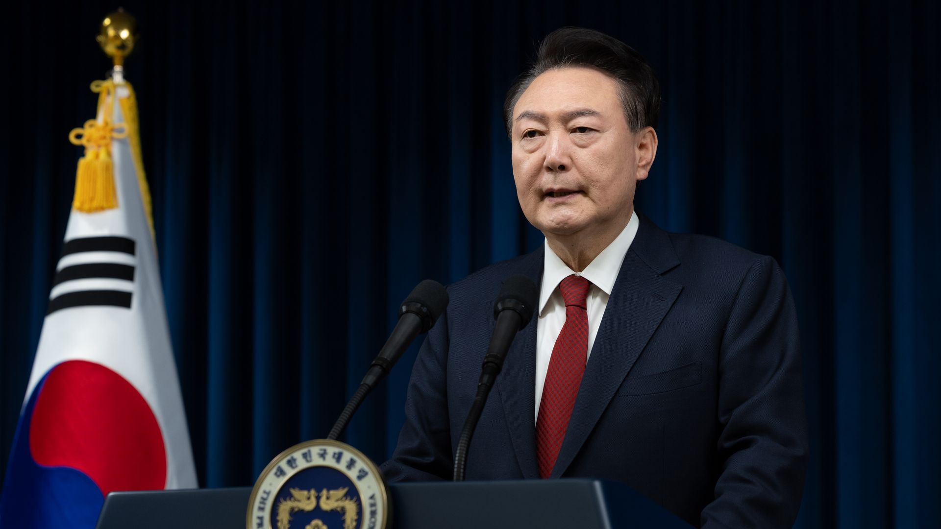 In this handout photo provided by the South Korean Presidential Office, South Korean President Yoon Suk-Yeol speaks to the nation at the Presidential Office on December 07, 2024 in Seoul, South Korea. 