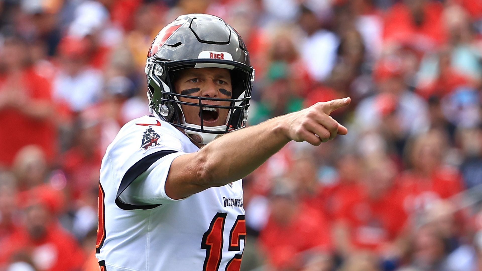 Tom Brady #12 of the Tampa Bay Buccaneers points against the Philadelphia Eagles during  the NFC Wild Card Playoff game at Raymond James Stadium on January 16, 2022.