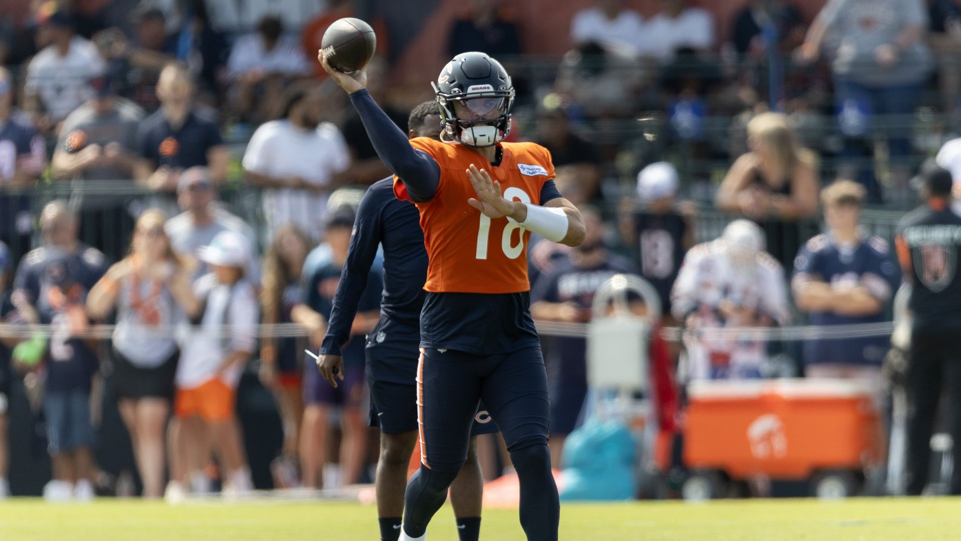 Photo of a quarterback throwing a pass 