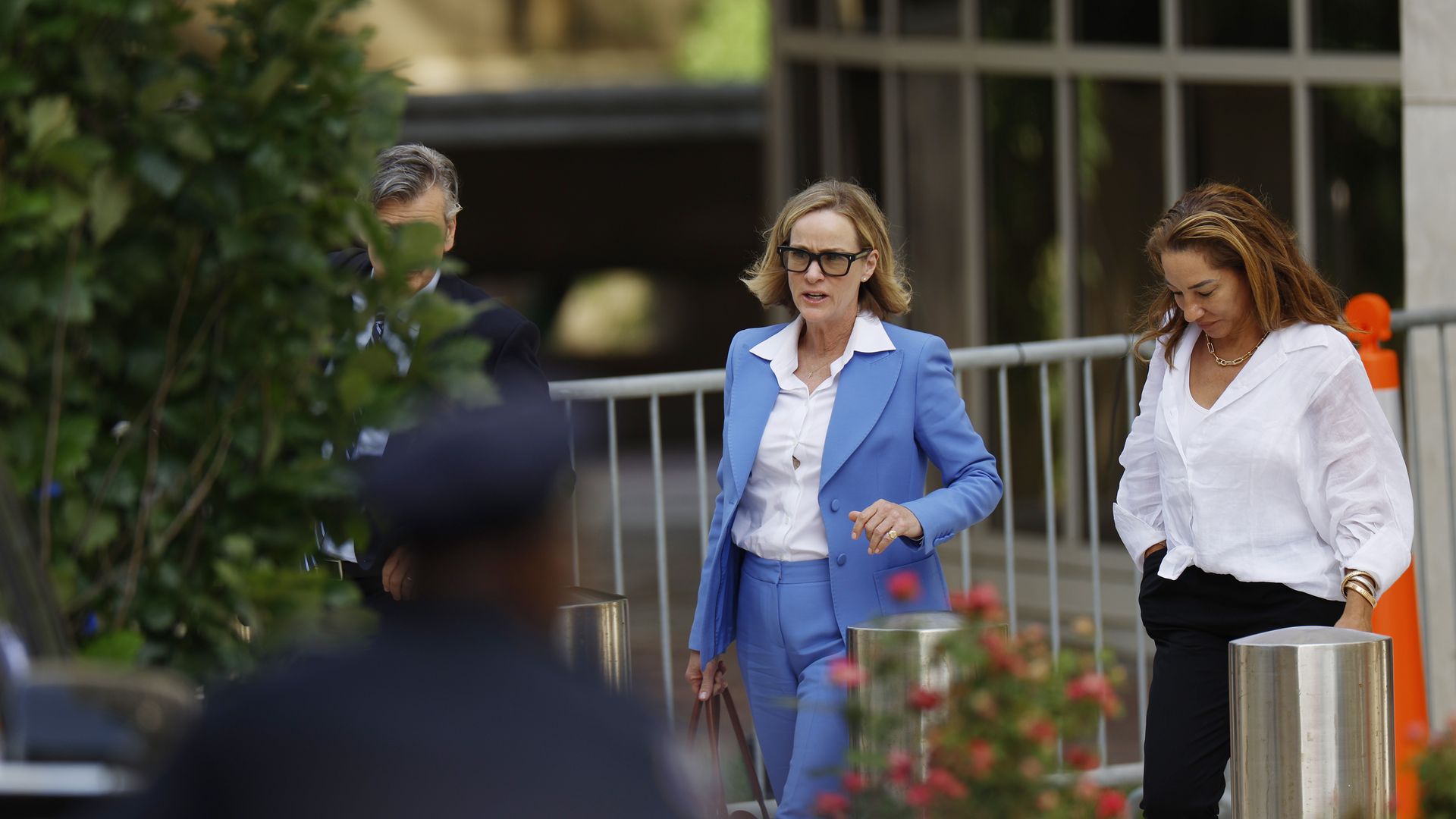 Kathleen Buehle in a blue suit with a white blouse